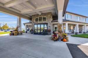 Avail Senior Living | Exterior front walkway decorated with fall decorations