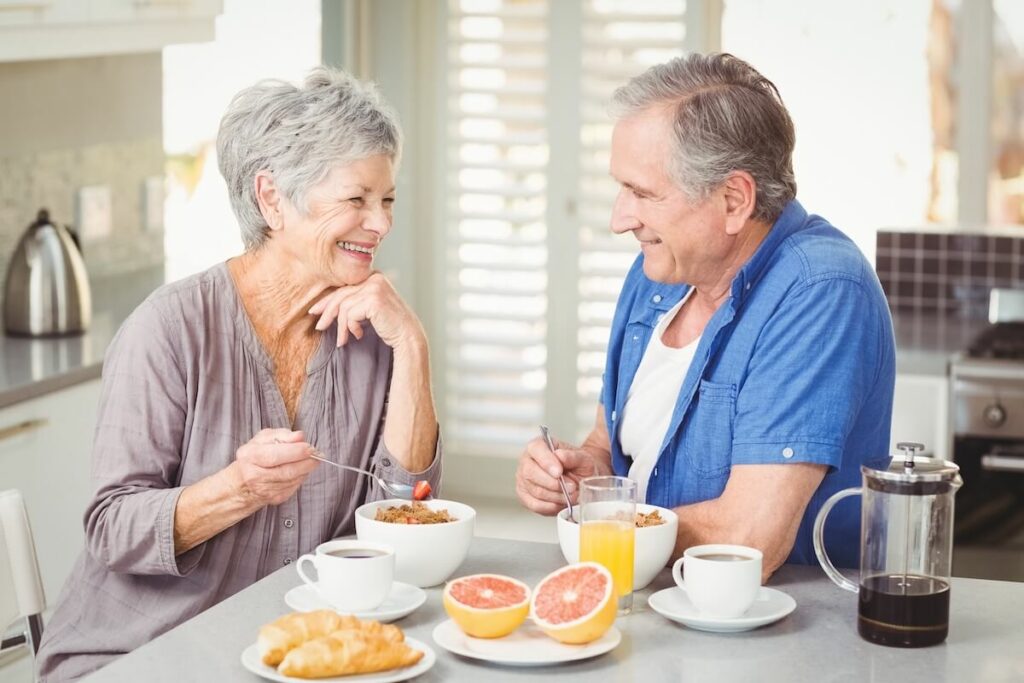 Avail | Happy senior couple enjoying breakfast together