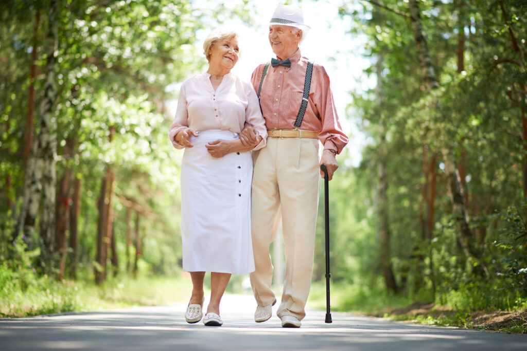 Avail Senior Living | Senior couple walking through park