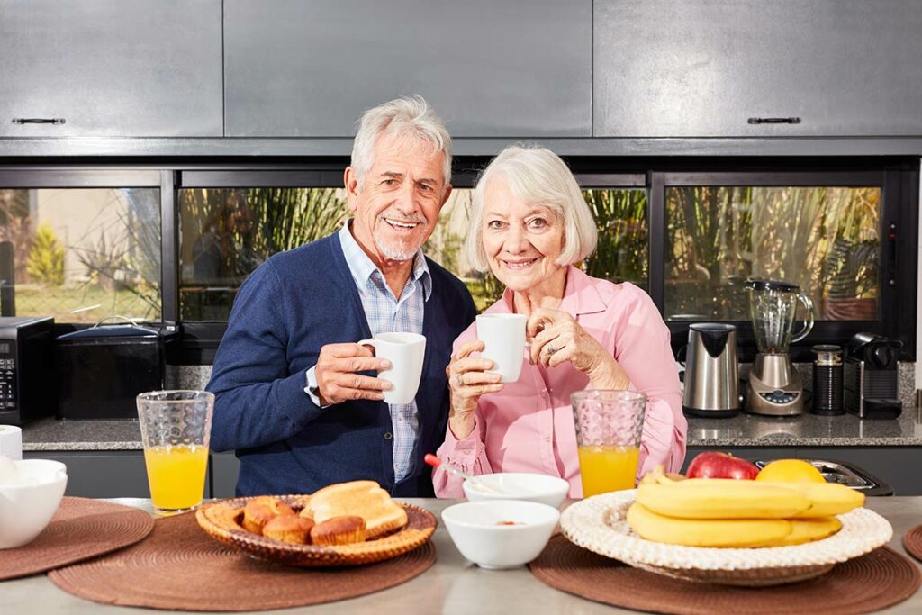 Avail Senior Living | Happy senior couple having coffee at lunch
