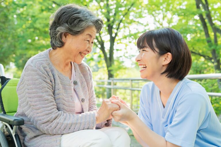 Avail Senior Living | Happy senior woman with smiling caregiver outside together