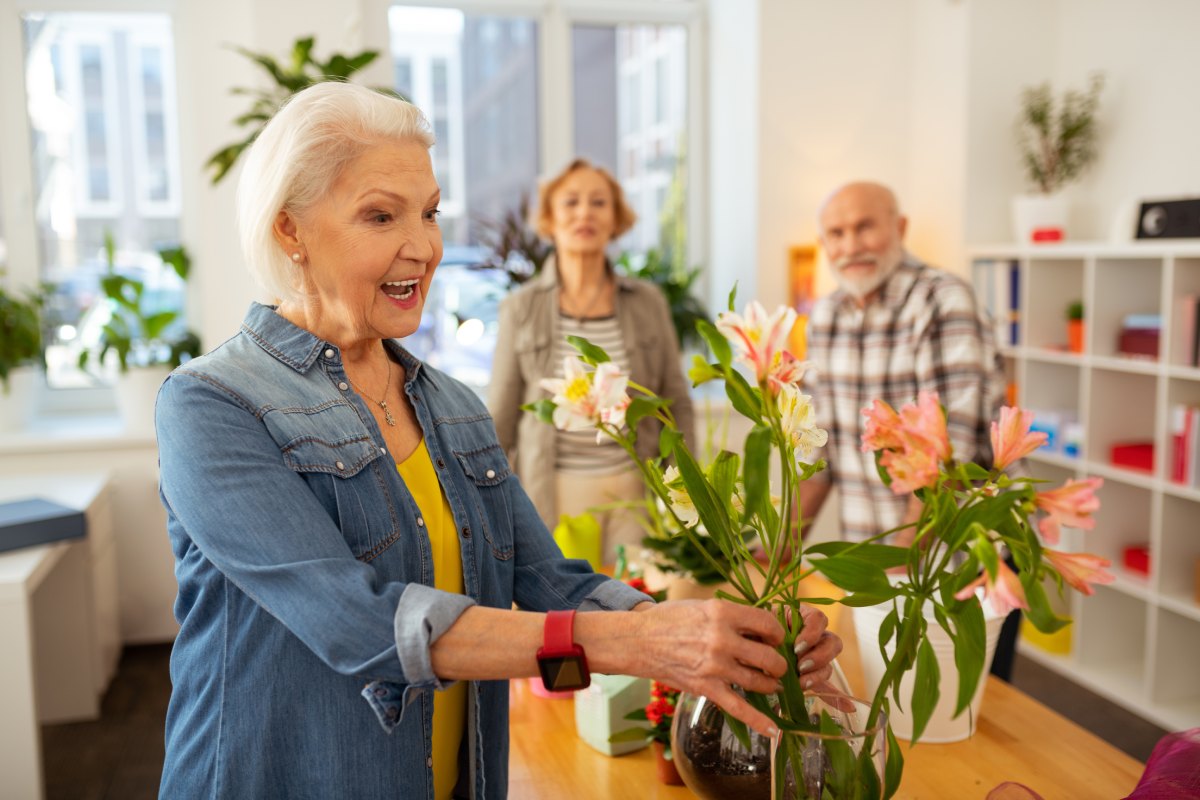 Avail | Senior woman working with flower arrangement