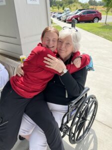 Avail | Senior and caregiver hugging